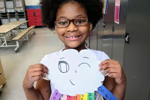 Girl Showing Off Art in YMCA Visual Arts Class