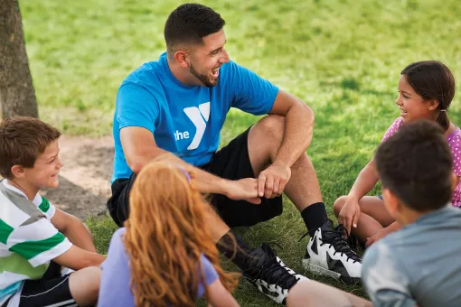 YMCA Summer Camp Volunteer Talking with Kids