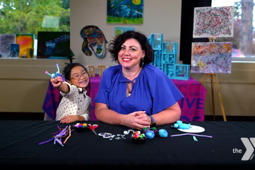 Margee Wilson and Chloe LY smile during a YMCA360 arts video. 