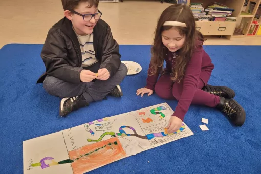 Creating their board games at winter camp! 