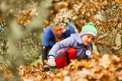 Child Playing in Leaves
