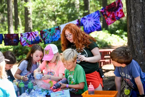 Action shot of a tie-dye session at a YMCA camp