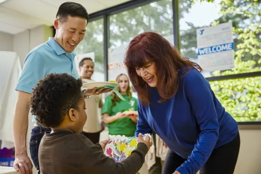 Child being welcomed at the Y