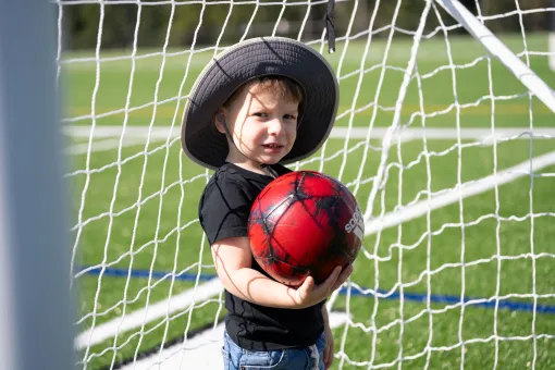  child holding soccer ball