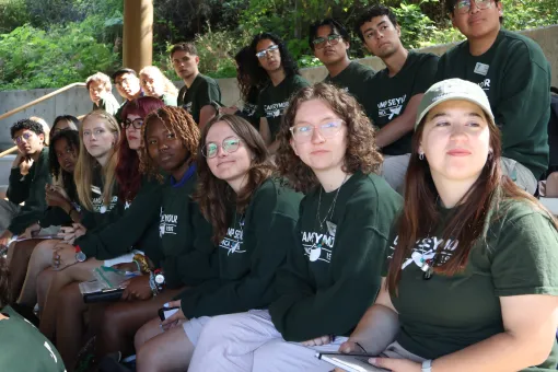Camp Seymour teen leadership participants sit together during a leadership training session, learning teamwork, responsibility, and counselor development at YMCA Camp Seymour.
