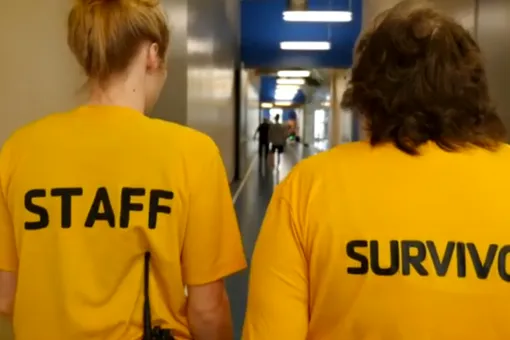 Livestrong Staff and Survivor wearing yellow shirts and walking the indoor track