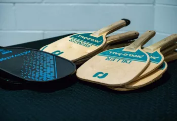 Pickleball paddles laying on a table