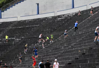 Unleashed participants run the steps at the Stadium High School football field