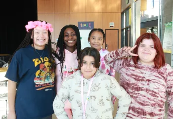 CCI students pose for a photo after school at the YMCA