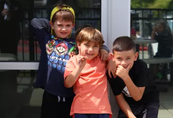 Group of friends pose outside during Healthy Kids Day at the YMCA