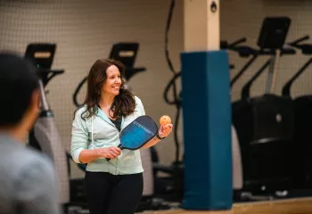Pickleball player getting ready to serve at the Bremerton Family YMCA