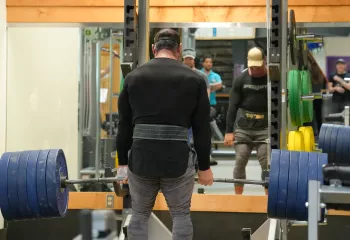 Action shot of someone deadlifting at the YMCA