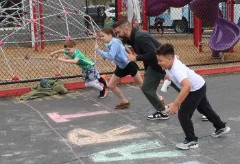 Action shot of the start of the fun run during Healthy Kids Day at the YMCA