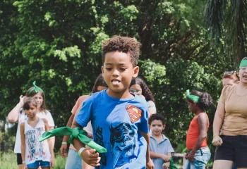 Image of youth running through play field