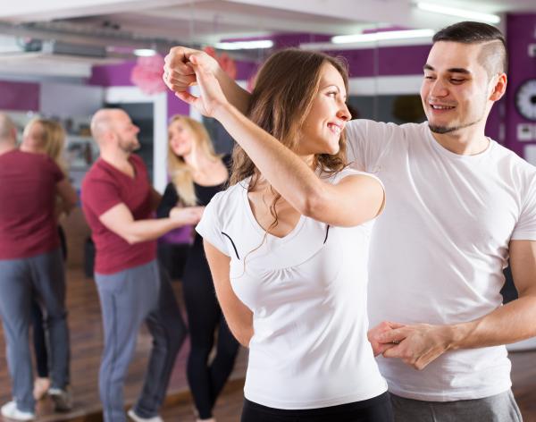 Dance partners in the middle of a spin move