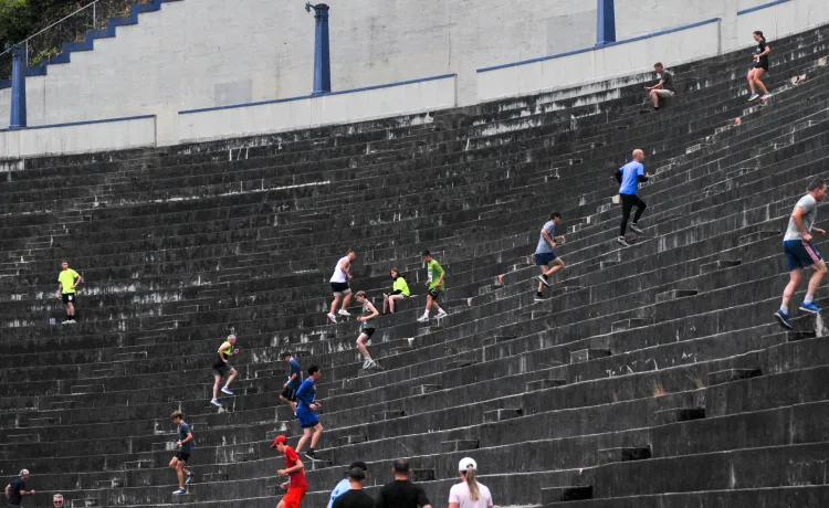 Unleashed participants run the steps at the Stadium High School football field