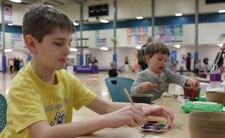 Healthy Kids day participants paint biodegradable planters at the YMCA