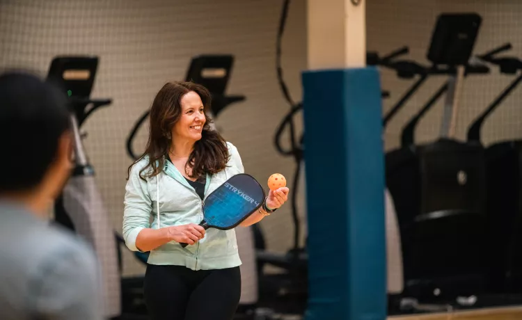 Pickleball player getting ready to serve at the Bremerton Family YMCA