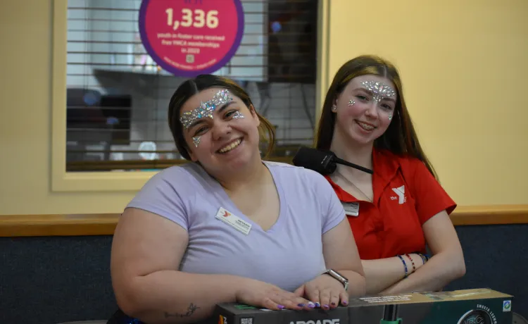 Bremerton family ymca staff pose at their booth during Healthy Kids day at the YMCA