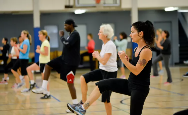 Action shot of a cardio class session at the Y on Pearl Street