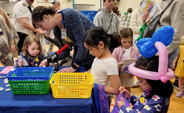 Shot of the button making table at Healthy Kids Day at the YMCA