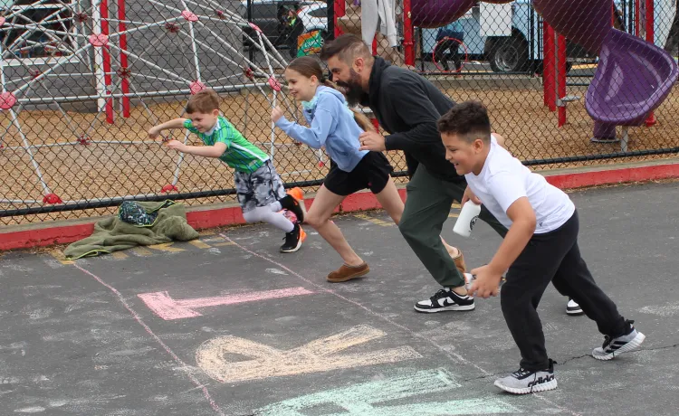 Action shot of the start of the fun run during Healthy Kids Day at the YMCA