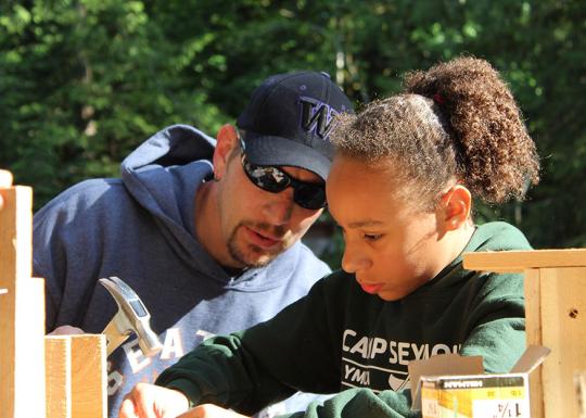 Father and child wood working at YMCA Camp Seymour
