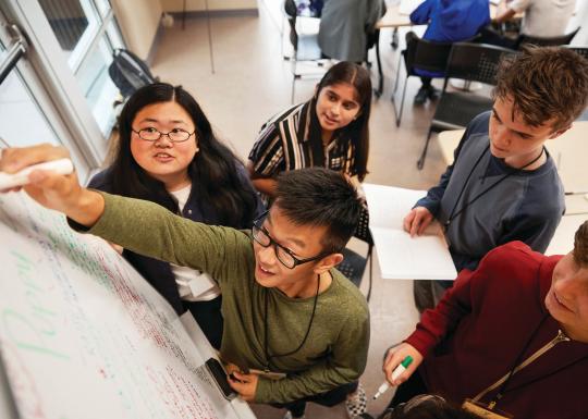 Teenagers working together on a project