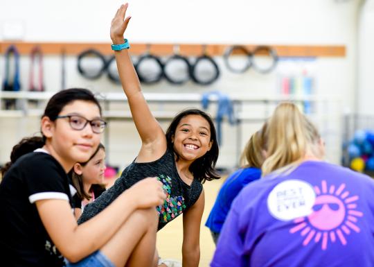 Kids having fun at YMCA summer camp indoors