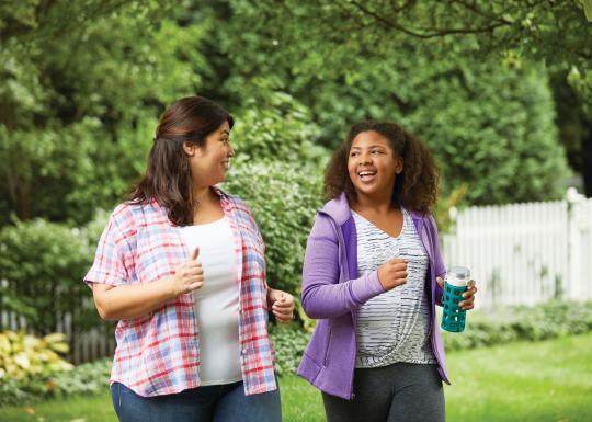 Mother and Daughter Walking Together With YMCA Weight Loss Program