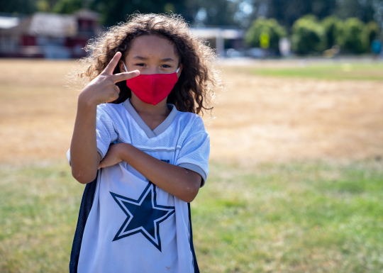 Child At YMCA Summer Camp Peace Sign