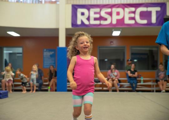 Girl Smiling At Youth Gymnastics