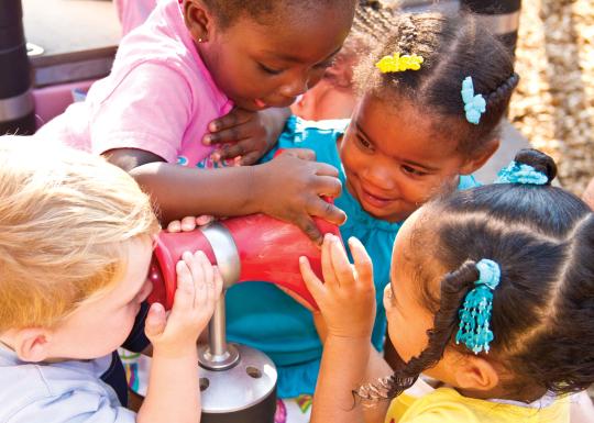 Kids Playing with Toy at YMCA Child Care Playground