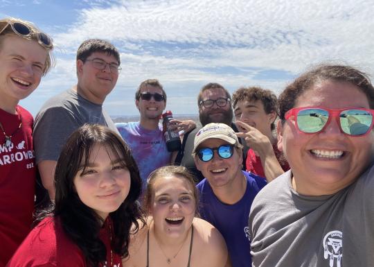 Teen group posing during summer of service