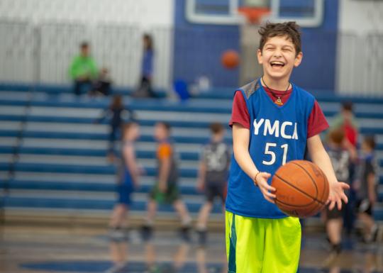 Youth basketball player laughing