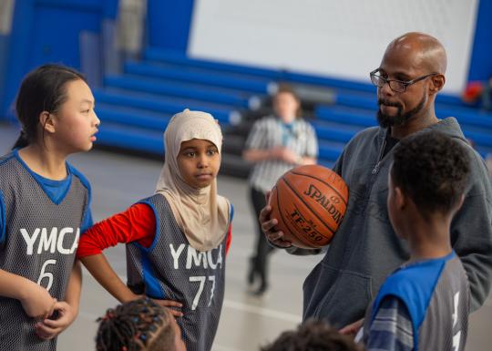 coach huddle at Y basketball game