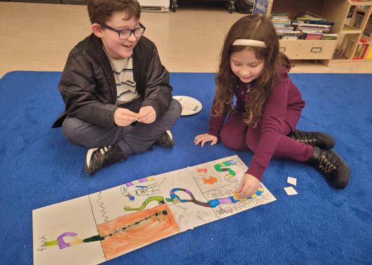 Creating their board games at winter camp! 