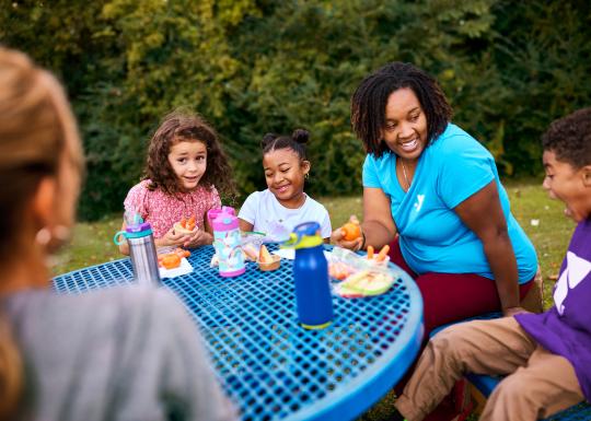 Eating Around the Table at YMCA Child Care Summer Day Camp