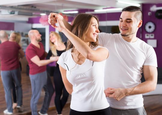Dance partners in the middle of a spin move