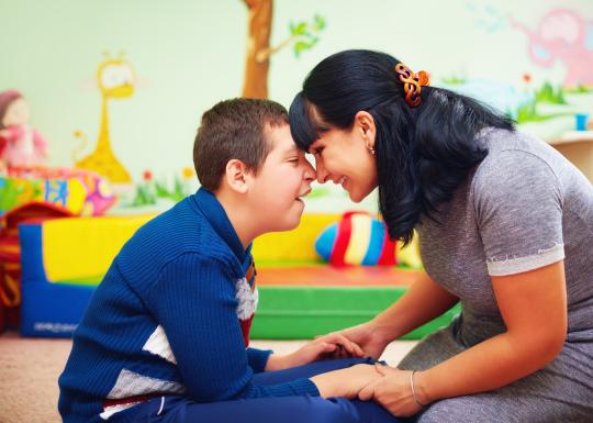 Mother and child share a moment at the YMCA event.