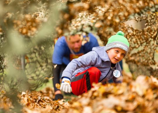 Child Playing in Leaves