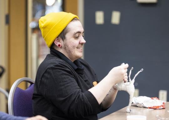 Art workshop participant crafting with clay at the YMCA