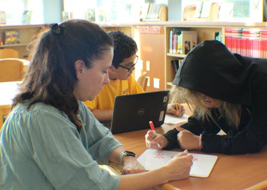 Community Learning Center Students work with an instructor through a math problem during open study at the YMCA