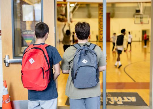 Late nite students enter the doorway of the main gym at the YMCA