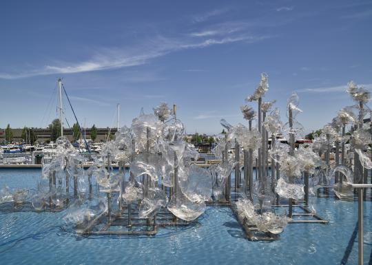 Photo of the glass sculptures in the water fountain outside the Museum of Glass