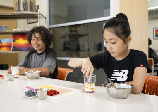Culinary students assemble parfaits during class at the YMCA