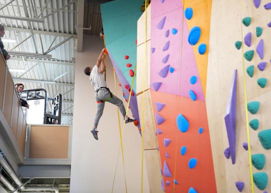 Climbing Up Pearl Street Rock Wall