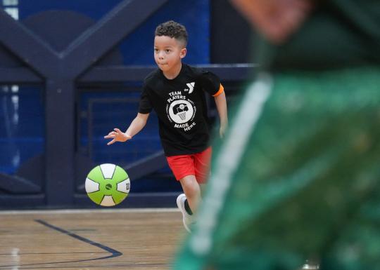 Dribbling Down the Court with Green Basketball