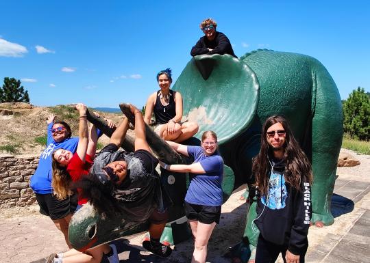 YMCA Summer of Service Playing on Triceratops