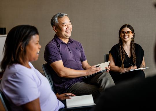Man and Women Having Group Conversation at YMCA Community Center